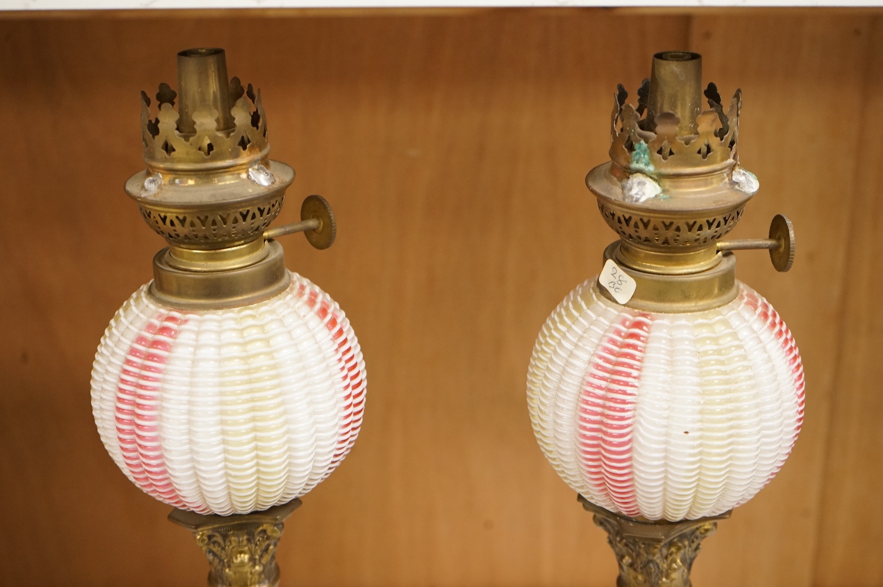 A pair of Victorian brass oil lamps with Webb style reservoirs, 33cm high
